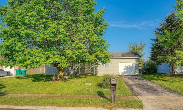 145 Danbury Rd, West Jefferson, OH 43162 - view of property hidden behind natural elements with an attached garage, a front yard, and aphalt driveway