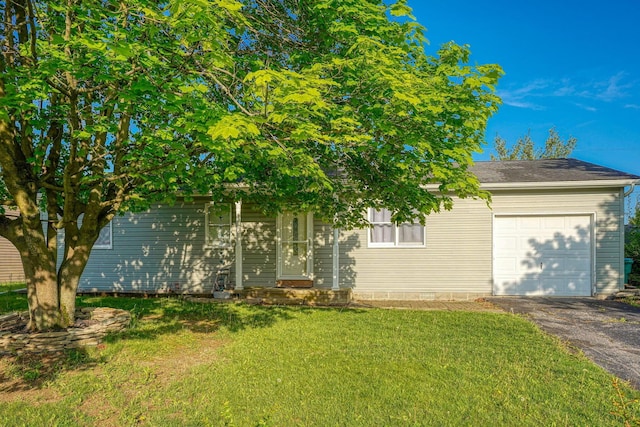 145 Danbury Rd, West Jefferson, OH 43162 - obstructed view of property featuring driveway, a front lawn, and a garage