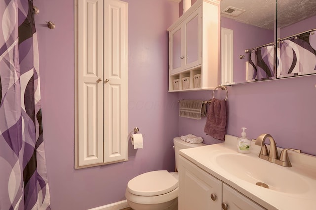 145 Danbury Rd, West Jefferson, OH 43162 - bathroom featuring vanity, toilet, a textured ceiling, a shower with curtain, and visible vents