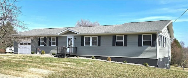 view of front of property featuring a front yard and an attached garage