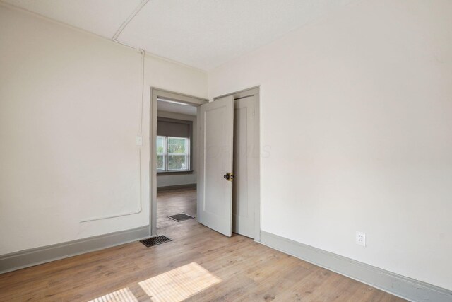 940 Leona Ave, Columbus, OH 43201 - empty room with light wood finished floors and baseboards