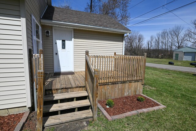 wooden deck with a lawn