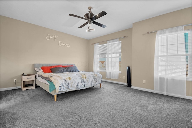 bedroom featuring baseboards, carpet floors, and ceiling fan