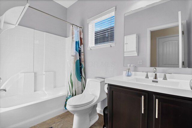 bathroom featuring tile patterned floors, shower / bath combination with curtain, toilet, and vanity