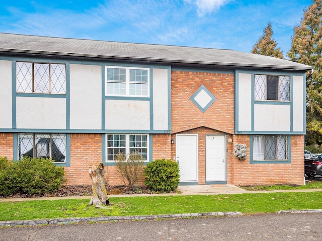 view of front of home featuring brick siding