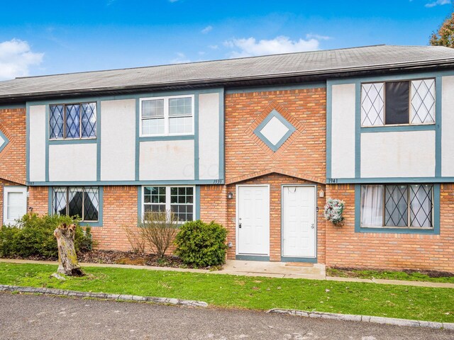 multi unit property featuring brick siding