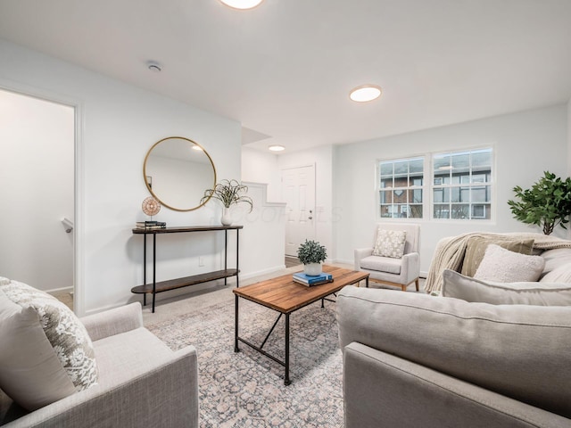 living area featuring baseboards