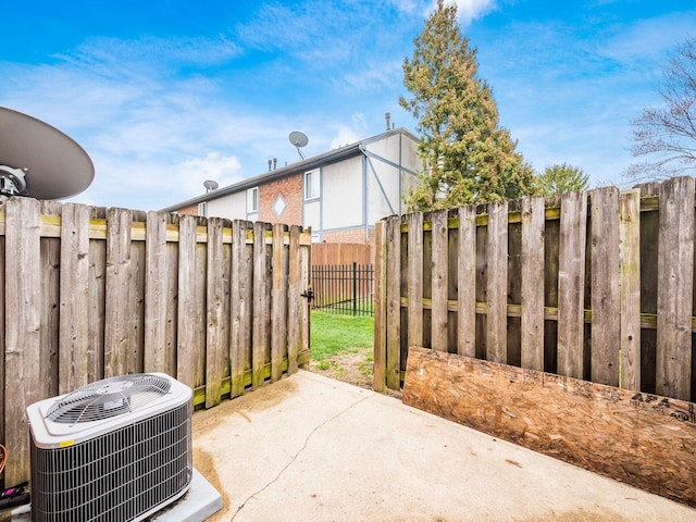 view of patio / terrace with cooling unit and fence