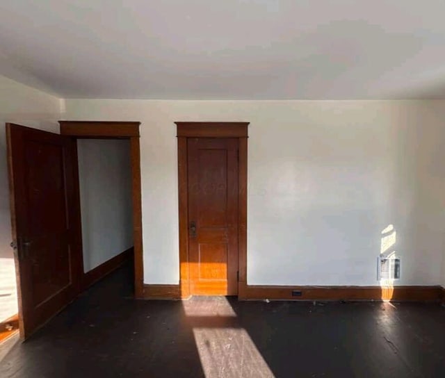 empty room with baseboards