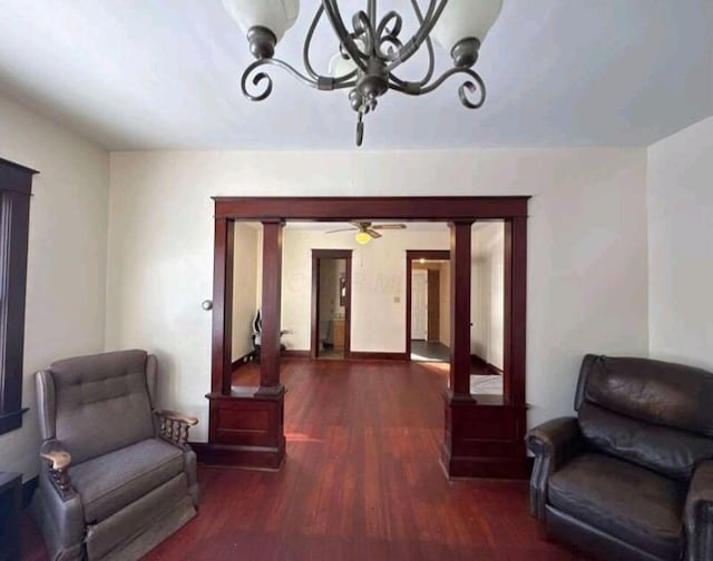 living area with an inviting chandelier and wood finished floors