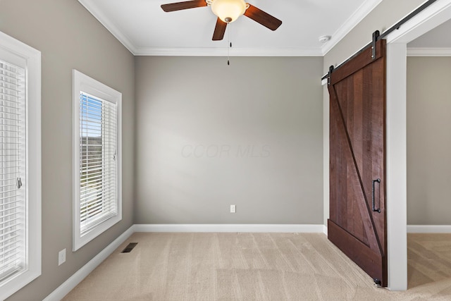 1462 Dogwood Loop, Powell, OH 43065 - unfurnished bedroom with baseboards, a barn door, crown molding, and light colored carpet