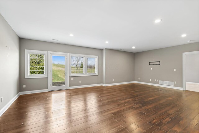 1462 Dogwood Loop, Powell, OH 43065 - empty room with wood finished floors, recessed lighting, baseboards, and visible vents
