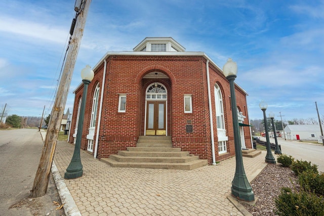 108 W Main St, Glenford, OH 43739 - view of front facade with brick siding and french doors