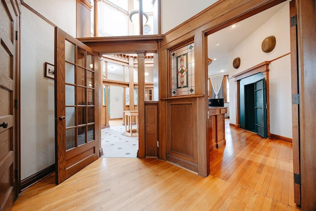 108 W Main St, Glenford, OH 43739 - hall featuring french doors, baseboards, and light wood-style floors