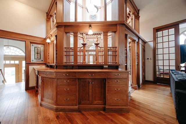 108 W Main St, Glenford, OH 43739 - interior space with light wood-style flooring, baseboards, and a towering ceiling