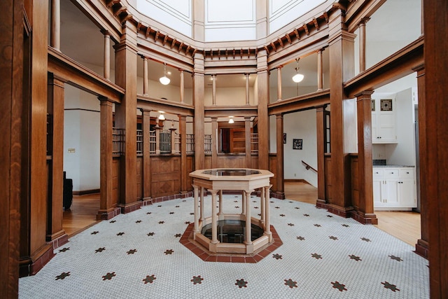 108 W Main St, Glenford, OH 43739 - interior space with light wood-style flooring and a towering ceiling