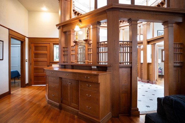 108 W Main St, Glenford, OH 43739 - interior space with vanity, a high ceiling, decorative columns, and wood finished floors