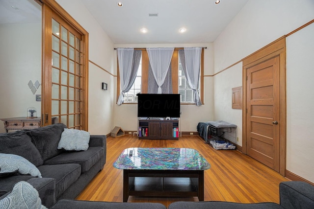 108 W Main St, Glenford, OH 43739 - living room with wood finished floors, visible vents, and baseboards