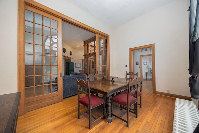 108 W Main St, Glenford, OH 43739 - dining space with french doors, baseboards, a towering ceiling, and light wood finished floors
