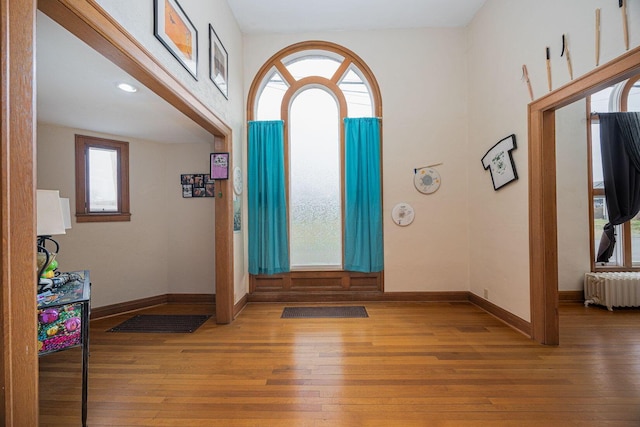 108 W Main St, Glenford, OH 43739 - entryway with baseboards, wood-type flooring, and radiator heating unit