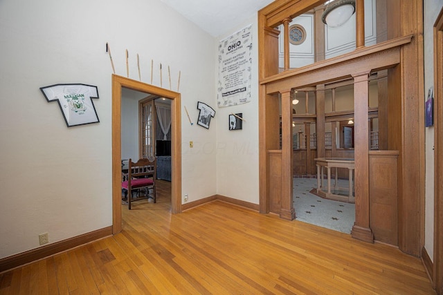 108 W Main St, Glenford, OH 43739 - empty room with hardwood / wood-style floors, a high ceiling, and baseboards