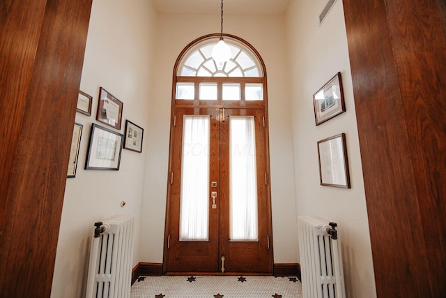 108 W Main St, Glenford, OH 43739 - foyer featuring radiator, french doors, and baseboards