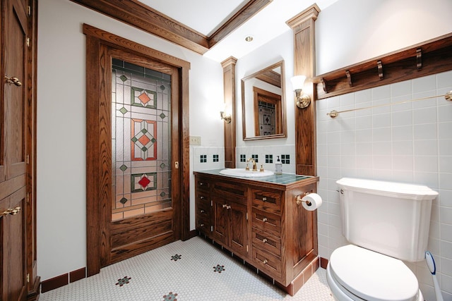 108 W Main St, Glenford, OH 43739 - bathroom featuring toilet, vanity, tile walls, and crown molding