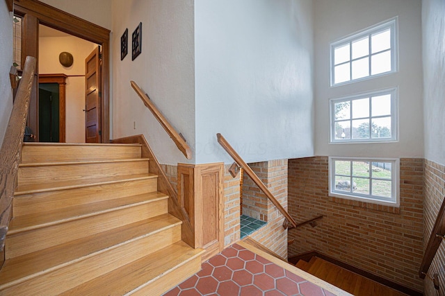 108 W Main St, Glenford, OH 43739 - stairway with a towering ceiling and brick wall