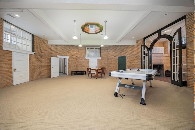 108 W Main St, Glenford, OH 43739 - recreation room featuring beam ceiling, carpet flooring, and brick wall