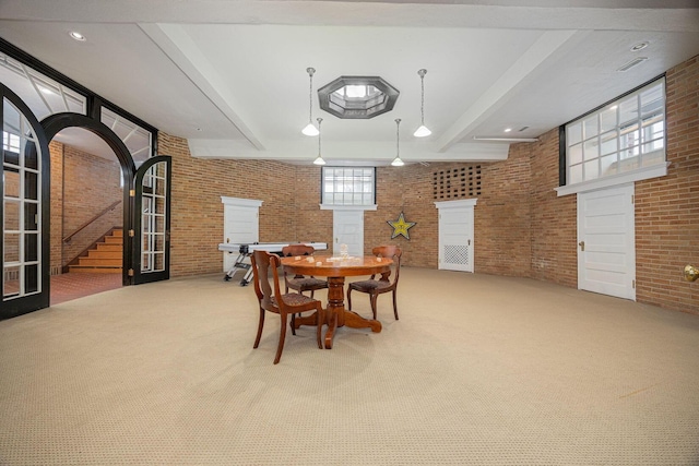 108 W Main St, Glenford, OH 43739 - carpeted dining room featuring stairway, ornate columns, brick wall, beam ceiling, and a fireplace