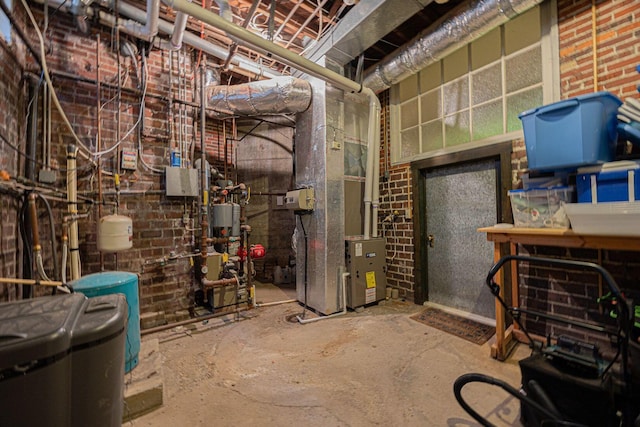 108 W Main St, Glenford, OH 43739 - unfinished basement featuring a heating unit and brick wall