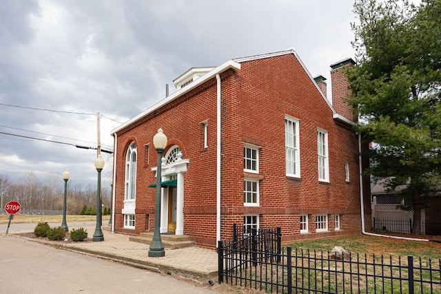 108 W Main St, Glenford, OH 43739 - view of home's exterior with brick siding and fence