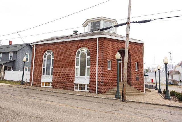 108 W Main St, Glenford, OH 43739 - view of front of house featuring brick siding and fence