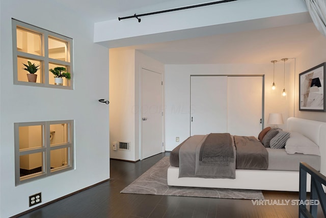 444 N Front St Unit 311, Columbus, OH 43215 - bedroom with wood finished floors and a closet