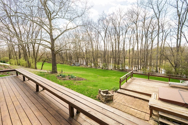 wooden deck with a lawn