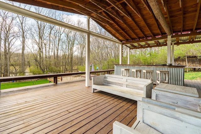 deck with fence and outdoor dry bar