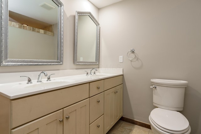 full bath with a sink, visible vents, toilet, and baseboards