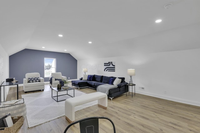 living room with recessed lighting, baseboards, lofted ceiling, and wood finished floors
