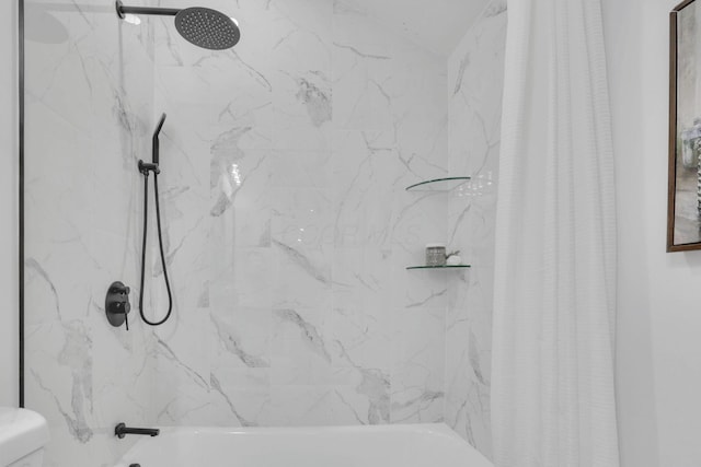 bathroom featuring toilet and shower / bath combo