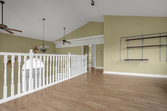 19643 Big Pine Rd, Laurelville, OH 43135 - interior space with a chandelier, baseboards, high vaulted ceiling, and wood finished floors