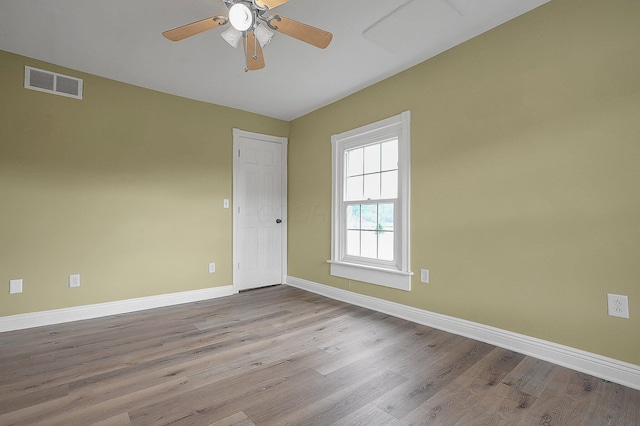 19643 Big Pine Rd, Laurelville, OH 43135 - spare room with baseboards, wood finished floors, visible vents, and ceiling fan