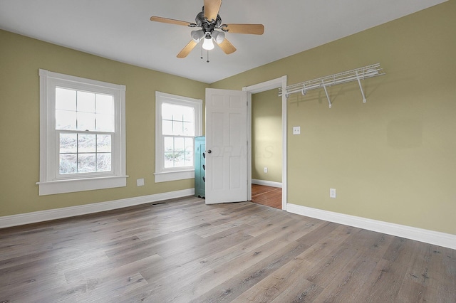 19643 Big Pine Rd, Laurelville, OH 43135 - unfurnished bedroom with visible vents, wood finished floors, baseboards, and ceiling fan