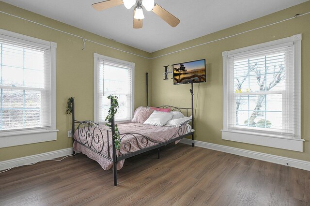 19643 Big Pine Rd, Laurelville, OH 43135 - bedroom with a ceiling fan, multiple windows, wood finished floors, and baseboards