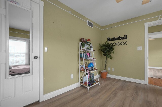 19643 Big Pine Rd, Laurelville, OH 43135 - interior space featuring visible vents, baseboards, wood finished floors, and a ceiling fan