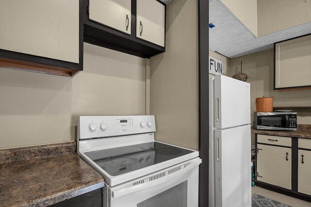 19643 Big Pine Rd, Laurelville, OH 43135 - kitchen with dark countertops and white appliances