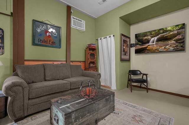 19643 Big Pine Rd, Laurelville, OH 43135 - living room featuring a wall unit AC, finished concrete flooring, visible vents, and baseboards