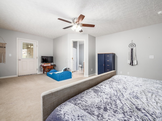 carpeted bedroom with baseboards, connected bathroom, a textured ceiling, and a ceiling fan