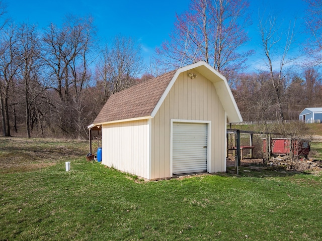 garage featuring a storage shed