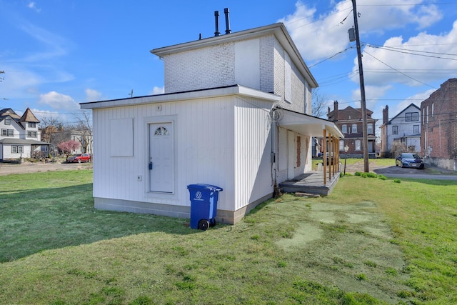 exterior space featuring a residential view and a lawn