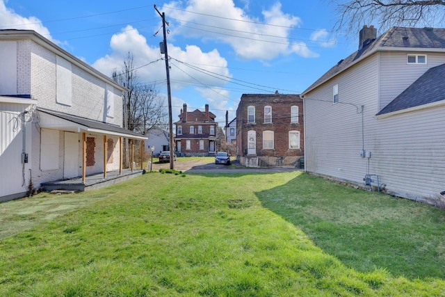 view of yard featuring a residential view